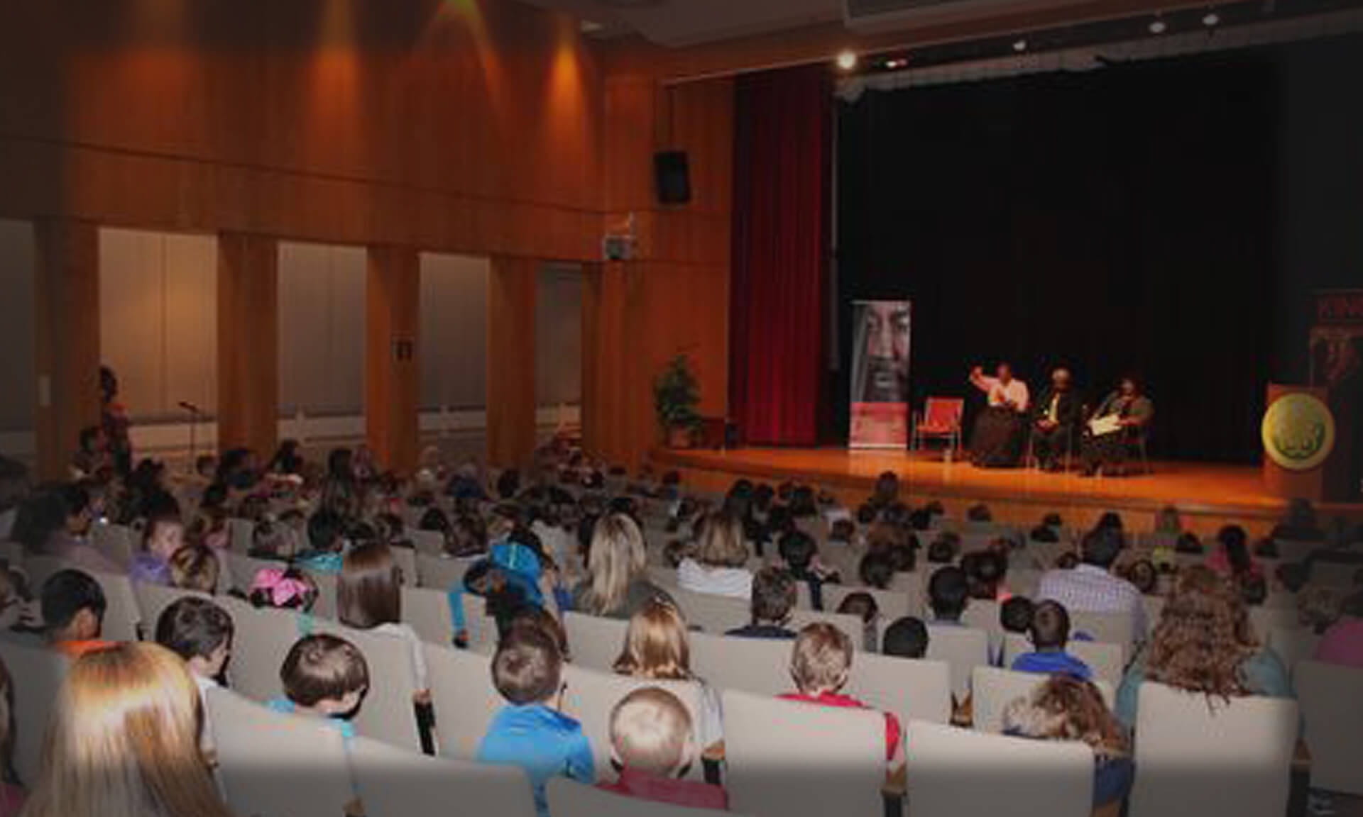 Auditorium with students and speakers